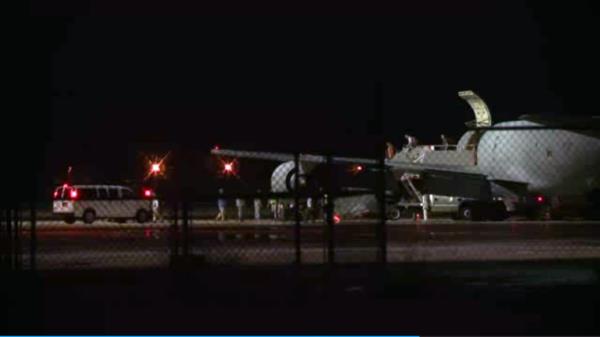 In this image from video people are greeted on arrival at Lackland Air Force base in San Antonio Texas early Friday morning June 13, 2014